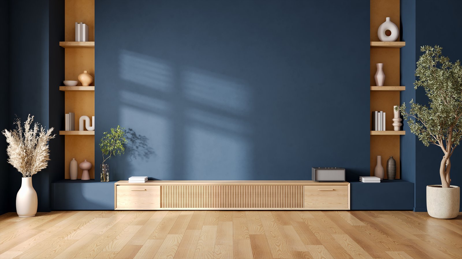 A blue room with wood shelving, a low cabinet, and plants.